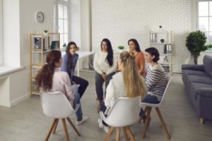 a group discusses womens drug addiction in therapy