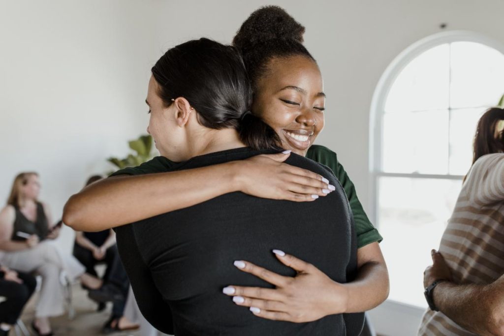 Women hugging after choosing a heroin addiction rehab program