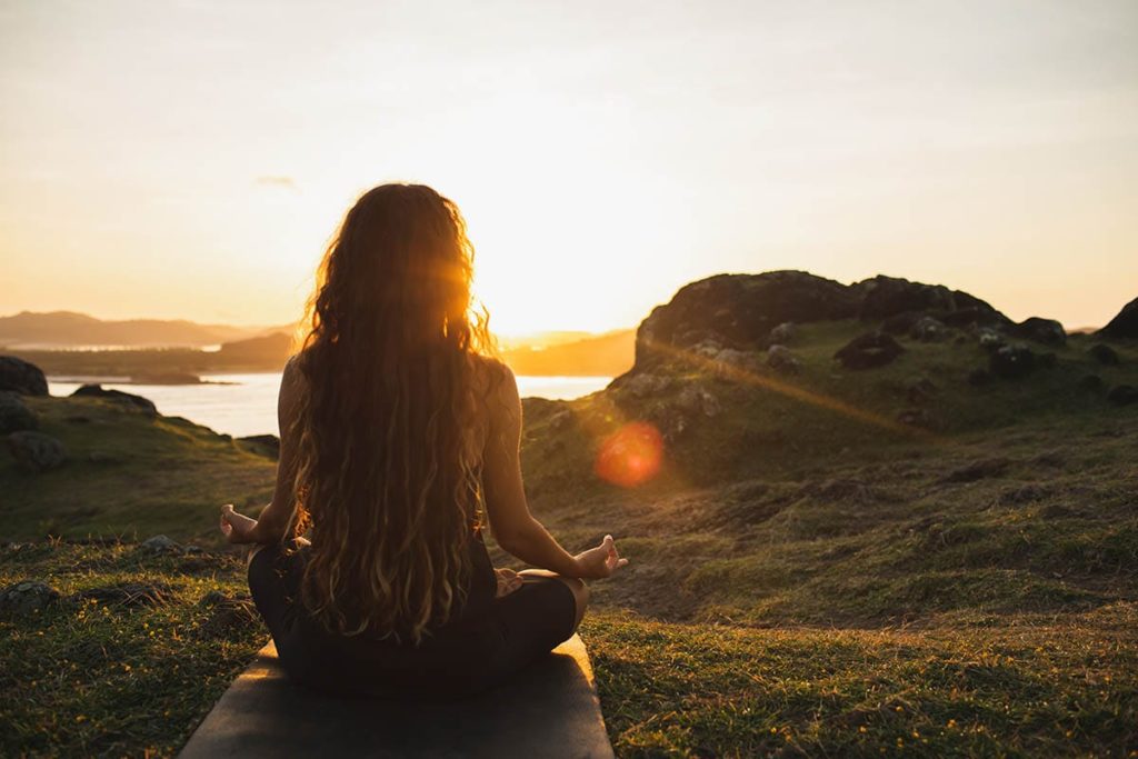 person looking at sunset thanks to benefits of holistic addiction therapy