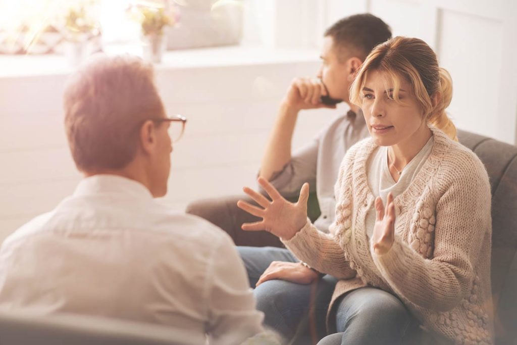 couple in family therapy discussing its importance to addiction