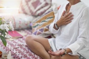 woman meditating in holistic therapy